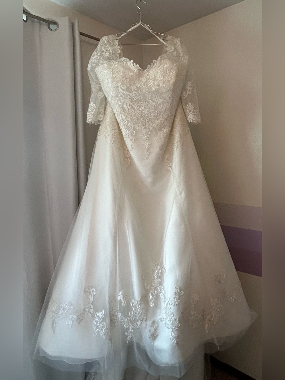 Ivory Lace A-Line Wedding Dress with, 3/4 length lace sleeves and chapel train.
